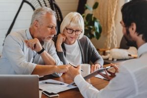 couple reviewing finances with advisor and possibly choosing an executor for their estate